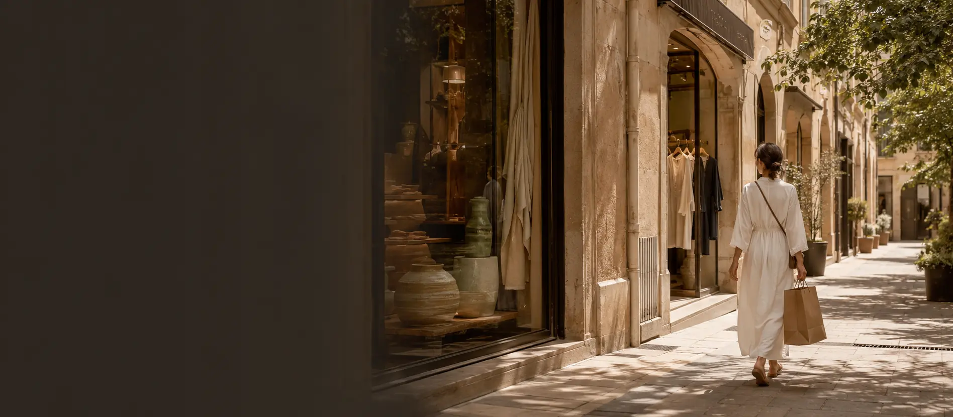 A maker wrapping a ceramic piece in a historic Aix boutique